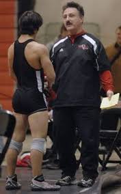 Press Photo/Paul L. Newby IIEast Kentwood coach Rick Smith talks with wrestler Nick Bohn during Saturday\u0026#39;s O-K Red Conference tournament. - medium_smith15