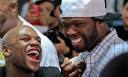 Floyd Mayweather, left, laughs