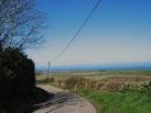 a mile out to sea, the islet of West Mouse (Maen y Bugael). - via Daymix