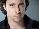 try with Alex O'Loughlin,