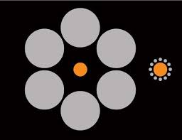 Which orange circle looks bigger? (Image: Samuel Schwarzkopf). Enlarge image. ADVERTISEMENT - dn19823-2_538