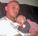 Proud father: Private Aaron McMillan cradles baby Josh. - article-1357444-0D387560000005DC-930_468x442