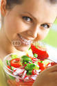 Foto: young beautiful woman eating healthy food (copyright) Roman Hense # ...