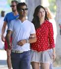 Zooey Deschanel holds hands with producer Jacob Pechenik during.