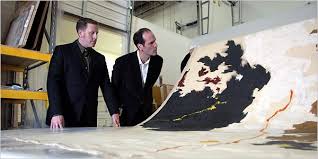 The art historian David Anfam, left, with Dean Sobel, director of the planned Clyfford Still Museum in Denver, witness the unrolling of a work by the ... - 18mado600.1