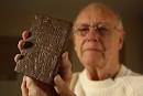 Edward Low displays a copy of