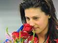 Stephanie Ryan smells a rose. Medal-winning smell . - 987260-stephanie-ryan-smells-a-rose