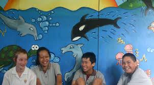 GOOD GUYS: Howick Intermediate students, from left: Louise Barclay, 13, Crystal Dalton, 13, Victor He, 12, and Tutere Strickland, 12, painted a mural for ... - 784690