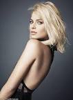 MARGOT ROBBIE stuns in a sheer scarlet gown for high fashion shoot.