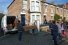 One of a number of coffins being delivered to a house in the reconstructed - via Daymix