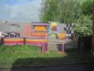 Psychedelic road side cafe. On north side layby on A5 just short of Halton - via Daymix