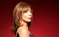 Rita Rudner red backdrop