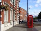 To the right is a memorial garden, and a market place/car park. - via Daymix