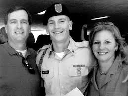 Sergeant James Regan, poses with mother Mary and father James. - jjregan-photo-04