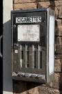 An old cigarette machine at - via Daymix