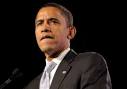 Barack Obama pauses while