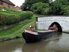 This is narrowboat "Tay" emerging from the east portal of the tunnel, - via Daymix