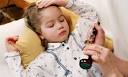 Sick child in bed