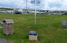 Amelia Earhart plaque and signpost near East Dock, Burry Port - via Daymix