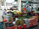 rough-skinned objects at the front are durian from Southeast Asia, - via Daymix