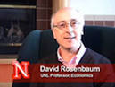 a professor of economics and associate director of the Jeffrey S. Raikes
