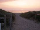 Last rays of the sun on Sandy Bay beach: also known as Porth Tywyn-Mawr. - via Daymix