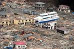 Japan tsunami and earthquake: Rescuers pick their way through.