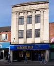 This building, now home to Blockbuster Video, looks like it might have - via Daymix