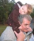 Maxie Uhl, holding Zoe, John