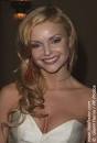 Izabella Miko Image Izabella Miko with hair wrapped around a large barrel curling iron ... Picture 6
