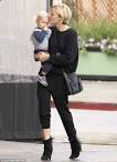 Make-up free Malin Akerman dotes on son Sebastian as she braves.