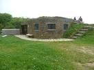 A clubhouse built into an embankment and invisible from a distance. - via Daymix