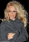 Pamela Anderson's driver pulled over by police as she tries to