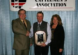 Pictured from left are David Blower of Farm World, and Fred and Cindy Penick. - Fred-M-Penick