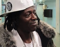 Moving too fast: Flavor Flav, real name William Drayton, was ticketed and released for driving over the speed limit on the way to his mother&#39;s funeral - article-2547791-1B085A4A00000578-7_634x497