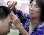 <p>Fanny Leung snips the bangs