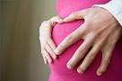 How to Conceal a Growing Pregnant Belly eHow