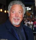 Tom Jones receding hairline is transformed into luscious locks.