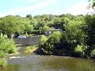 Mill Cottage Montessori School. View of the school across the River Calder - via Daymix