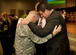 Chaplain Capt. Ben Ellington, left to right, First Baptist Church Pastor Randy Wallace and Memorial Baptist Church Pastor Ken Cavey pray together at a ... - prayer2