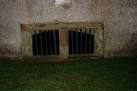 On the east gable of Polwarth Kirk is a grate at ground level which looks - via Daymix