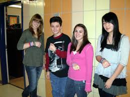 Scholars Academy students at Susan Wagner High School who sold \u0026quot;Paws for a Cause\u0026quot; wristbands, from left, Anetta Nowak, Robert Coale, Alison Montalvo and ... - 9267774-large