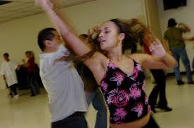 Salsa dancer Jessica Alicea, 17, of Orlando gets twirled by a classmate during a class led by Salsa Heat Dance Studio instructors at the Robert Guevara ... - orlando-2006-6