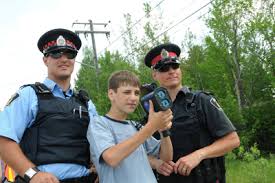 Ecole Secondaire Catholique L\u0026#39;Horizon grade 9 student Serge Legault learns how to use laser radar to detect speeding motorists with the help of Greater ... - 310510_MS_LHorizon_9