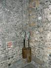 These two weights drive the clock. They are winched up by means of hand - via Daymix