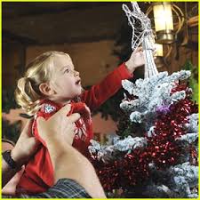 Mia Talerico reaches up high to place the star upon her family\u0026#39;s Christmas tree in this new still from Good Luck Charlie, It\u0026#39;s Christmas. - good-luck-charlie-christmas