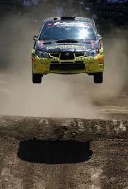 Drivers Tanner Foust and Christine Beavis take a jump in the Rally Car race during the summer X Games 14 at Home Depot Center on August 3, 2008 in Carson, ... - X+Games+14+Day+4+BY6X5poItr8l