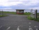 The view of a car parking area and an abandoned kiosk from which milk shakes - via Daymix