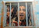 Abdel Kareem Nabil Suleiman looking out of a police bus after his trial in ... - 0312Blogger