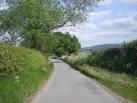 The School Bus heads home. The Wrekin looms in the background. - via Daymix